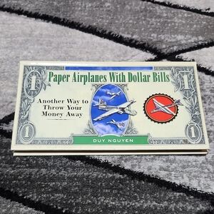 PAPER AIRPLANES WITH DOLLAR BILLS BY DUY NGUYEN 2005